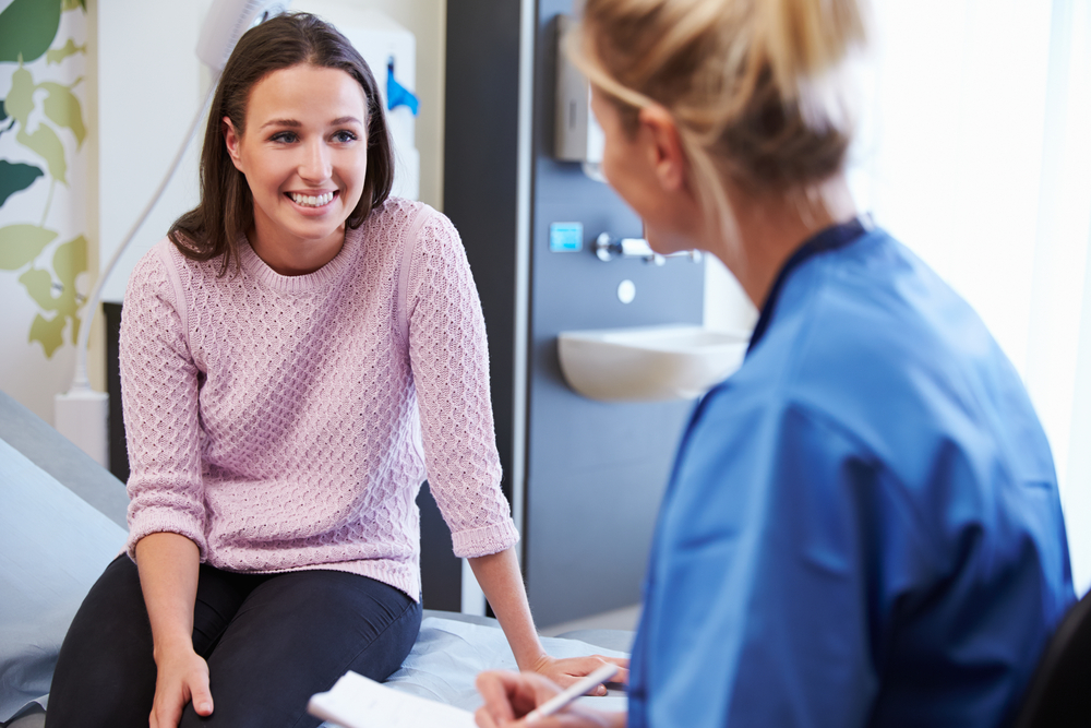 doctor and patient talking during well woman visit