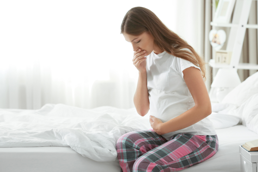 young pregnant woman suffering from nausea