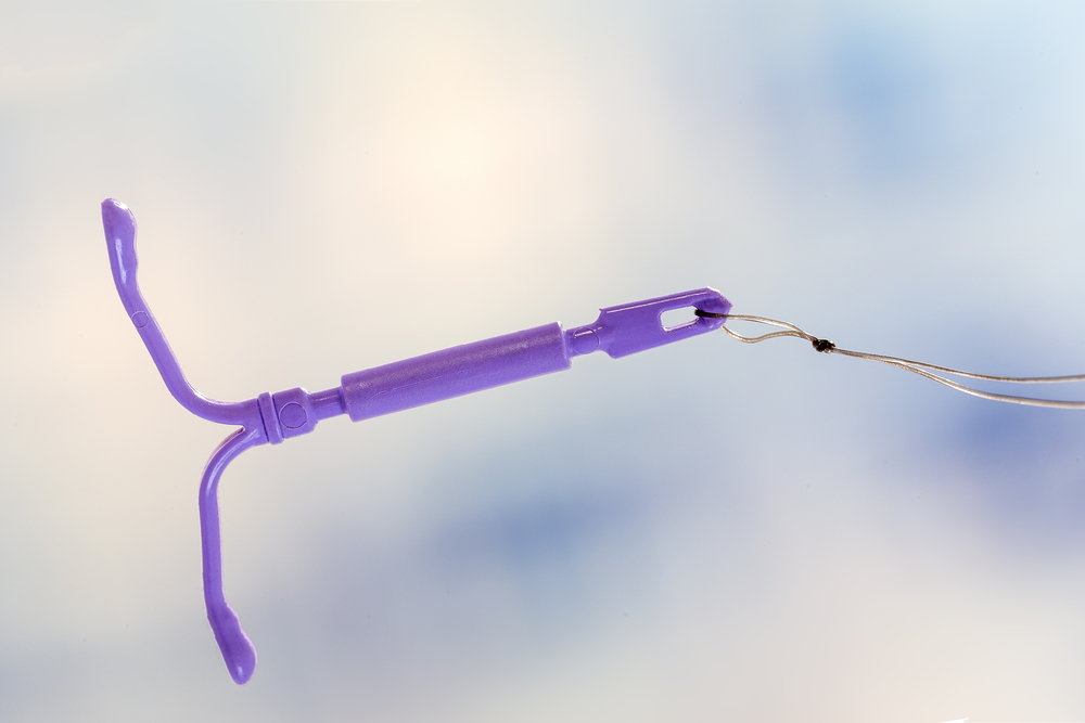 Close-up of intrauterine device on a blurry background