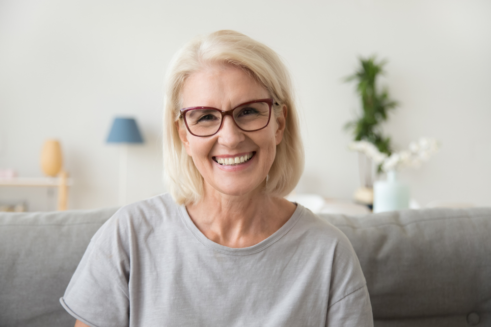 older woman smiling.