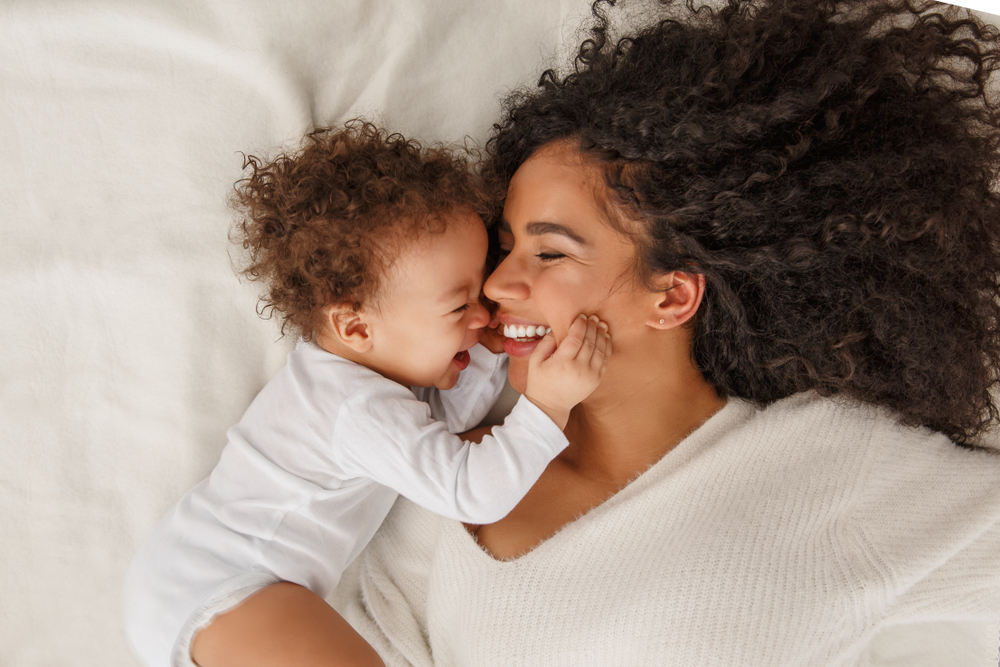 woman smiling with child.